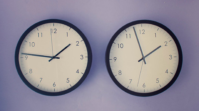 a couple of clocks that are on the wall