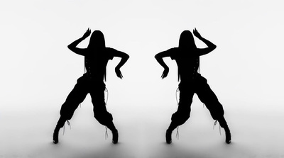 two silhouettes of a woman dancing on a white background