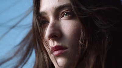 a close up of a person with long hair