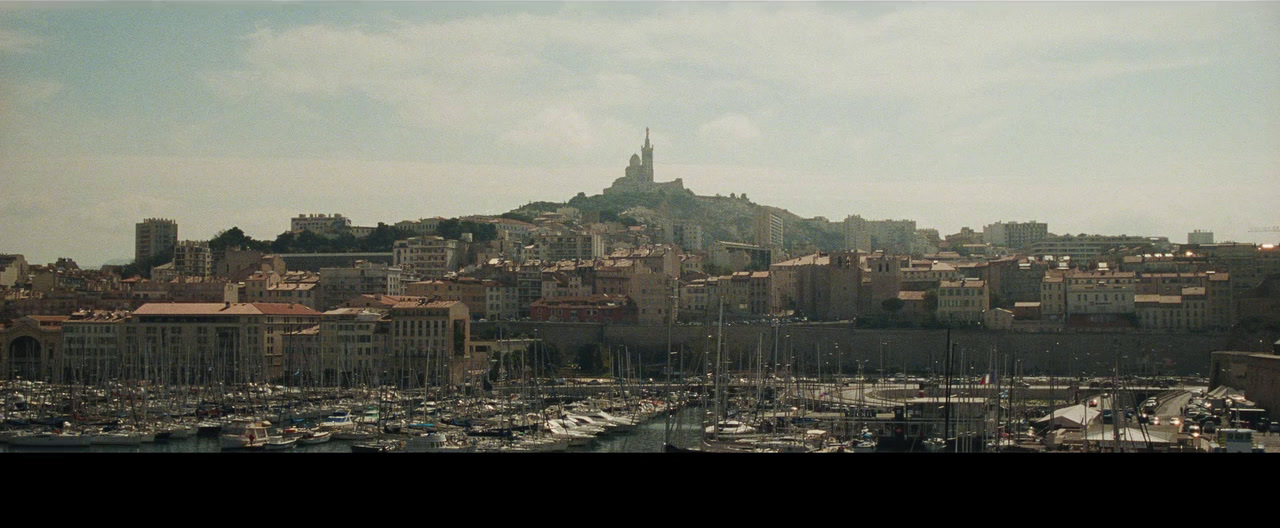 a view of a city with lots of boats in the water