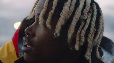 a close up of a person with dreadlocks