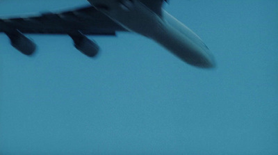 a large jetliner flying through a blue sky