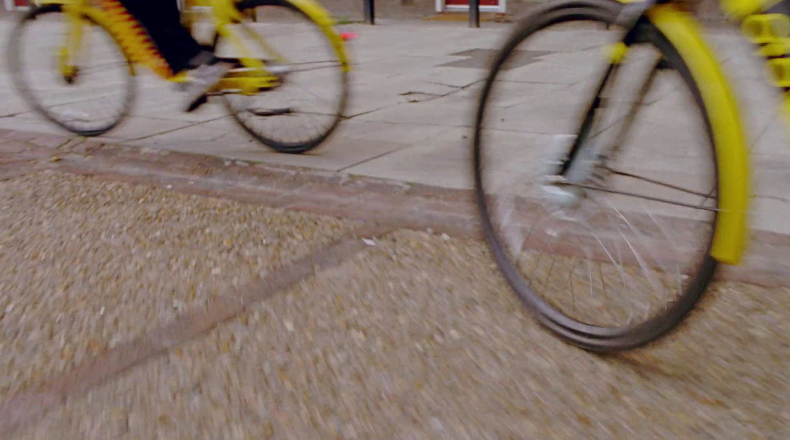 a blurry photo of two bicycles on a city street