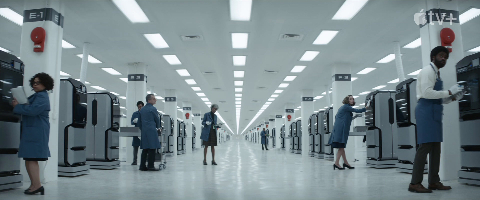 a group of people standing in a large room