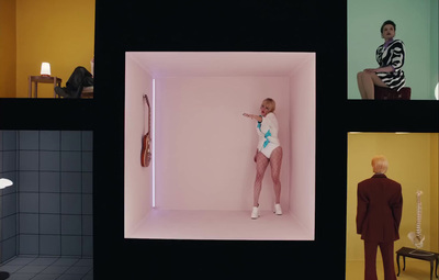 a man standing in a white box in a room