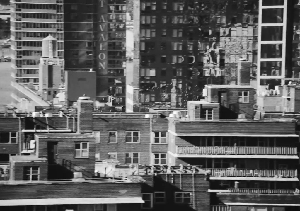 a black and white photo of buildings in a city