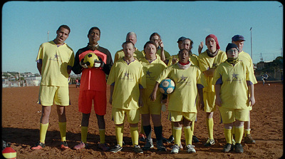 a group of soccer players pose for a picture