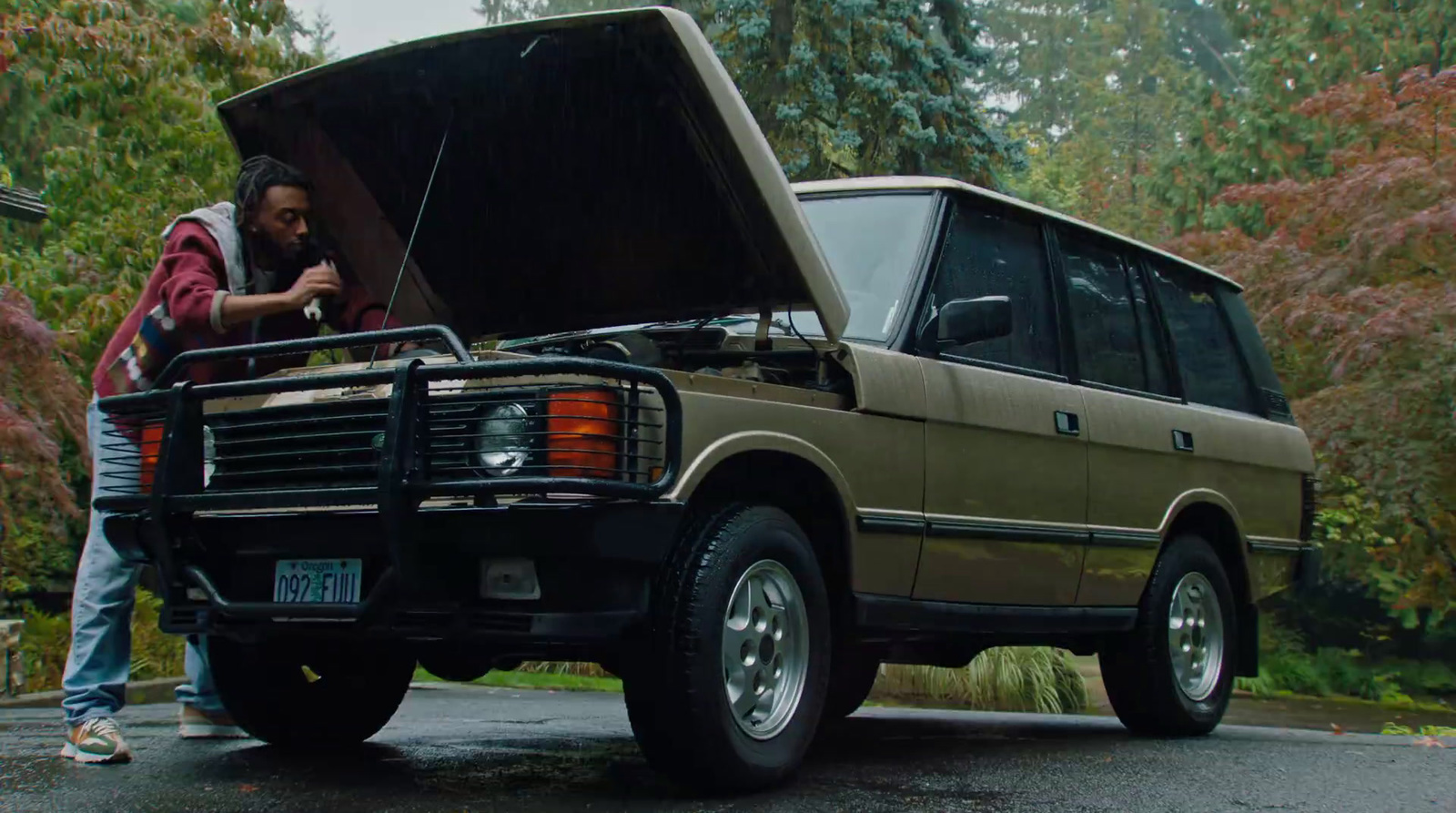 a man standing in the back of a truck