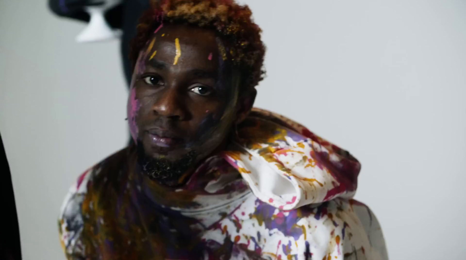 a man with paint all over his face