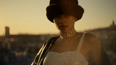 a woman in a white dress and a black hat