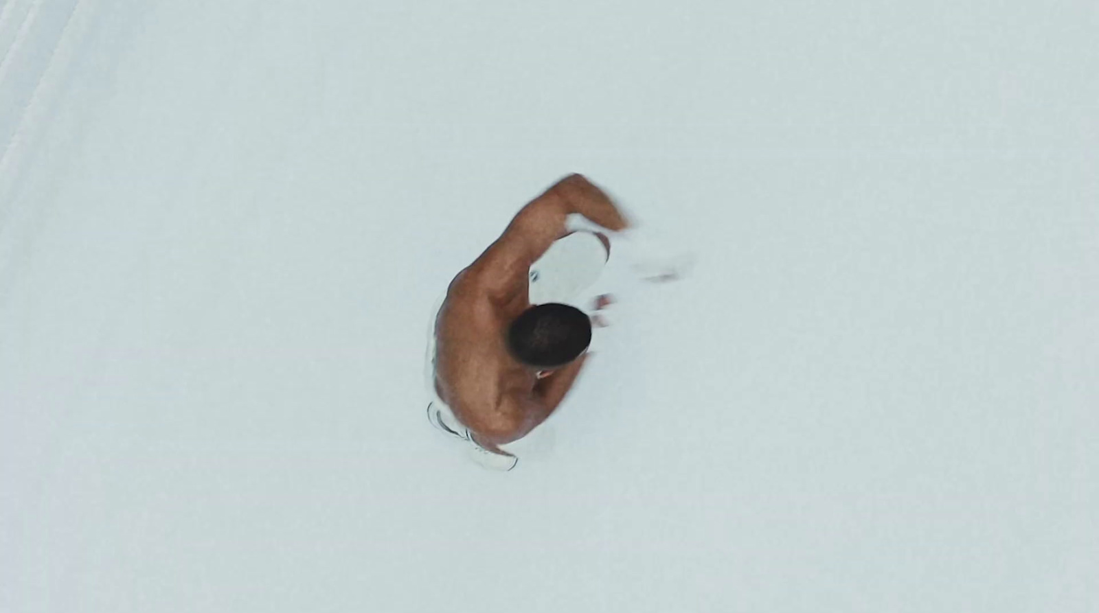 a man standing on top of a snow covered slope