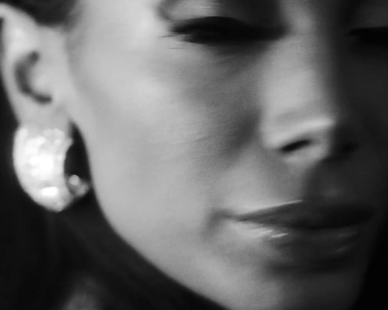 a close up of a person wearing earrings