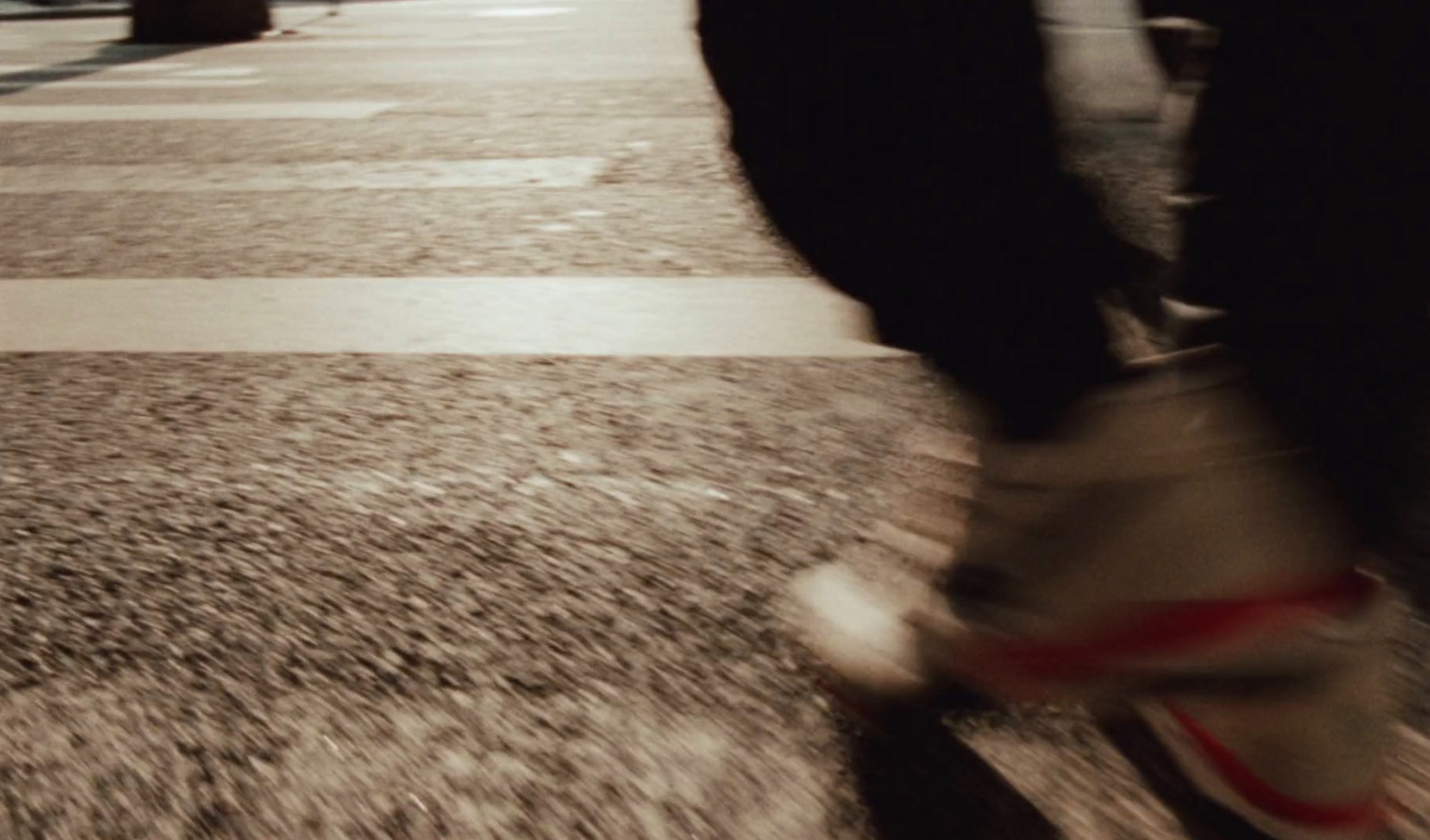 a person riding a skateboard down a street