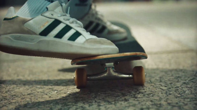 a close up of a person riding a skateboard