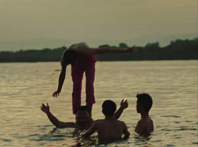 a man jumping into the water from a raft