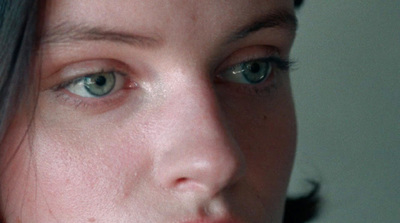 a close up of a person with blue eyes