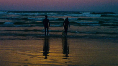 a couple of people that are standing in the water