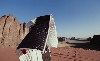 a close up of a surfboard in the desert