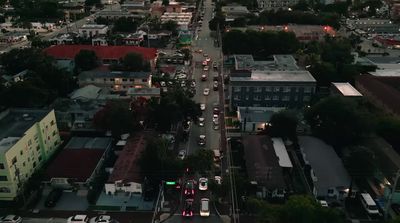 an aerial view of a city at dusk