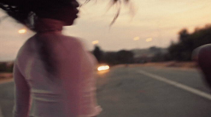 a blurry photo of a woman riding a skateboard