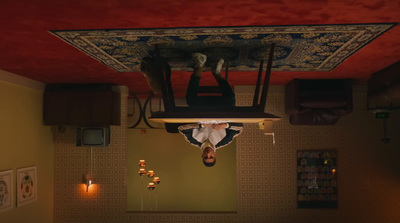 a person hanging upside down from a ceiling