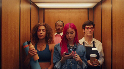 a group of people standing in a elevator