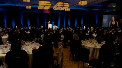 a group of people sitting at tables in a room