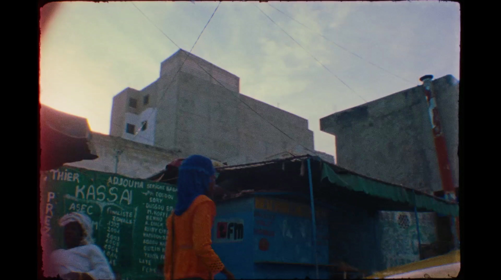 a couple of people standing in front of a building