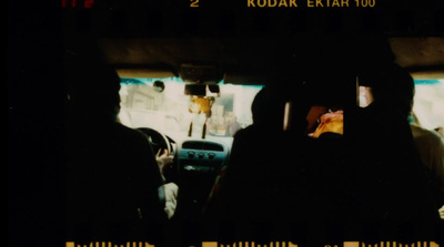 a group of people sitting in the back of a car