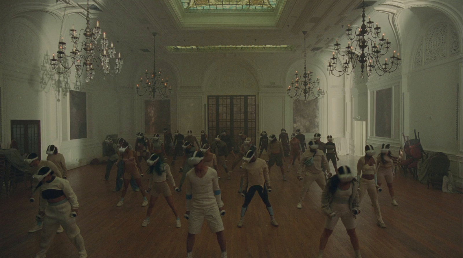 a group of people dancing in a large room