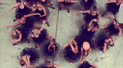 a group of dancers in black tutu skirts