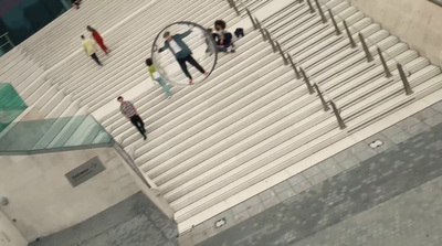 a group of people walking up and down a flight of stairs