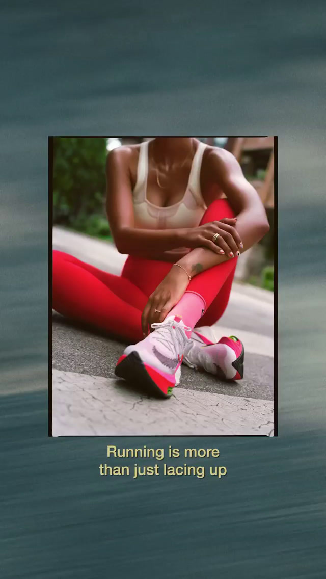 a woman sitting on the ground with her legs crossed