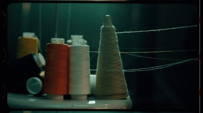 a group of spools of thread sitting on top of a table