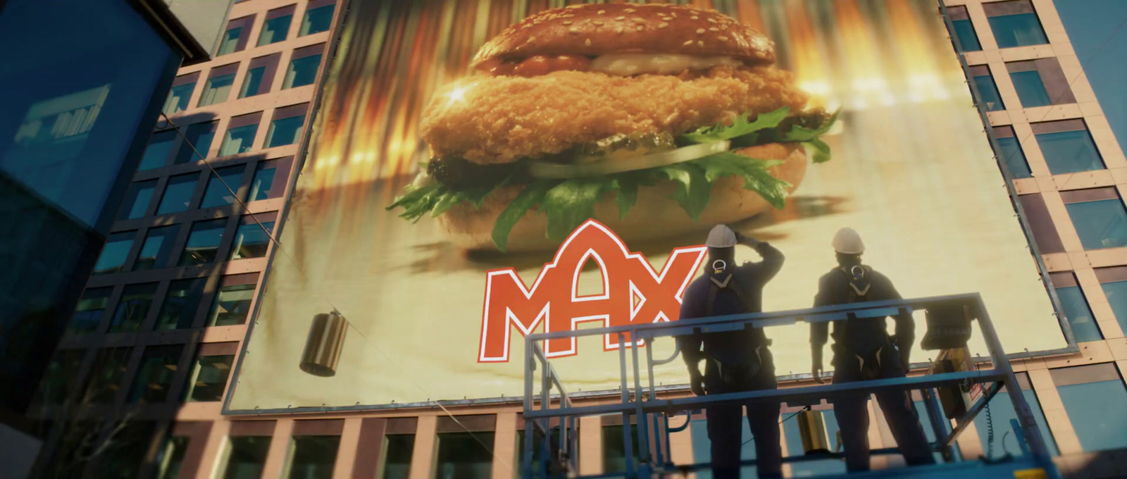 a giant advertisement of a giant hamburger on the side of a building