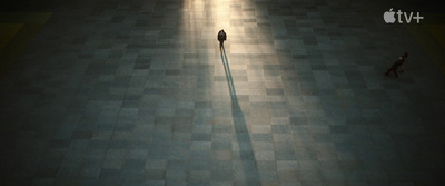 a person standing alone in an empty room