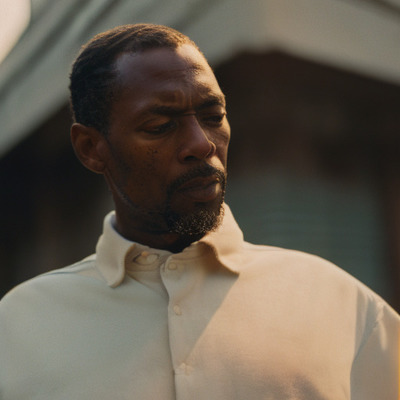 a close up of a person wearing a white shirt