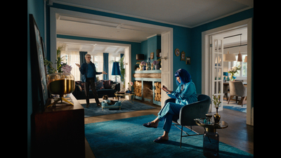 a woman sitting in a chair in a living room