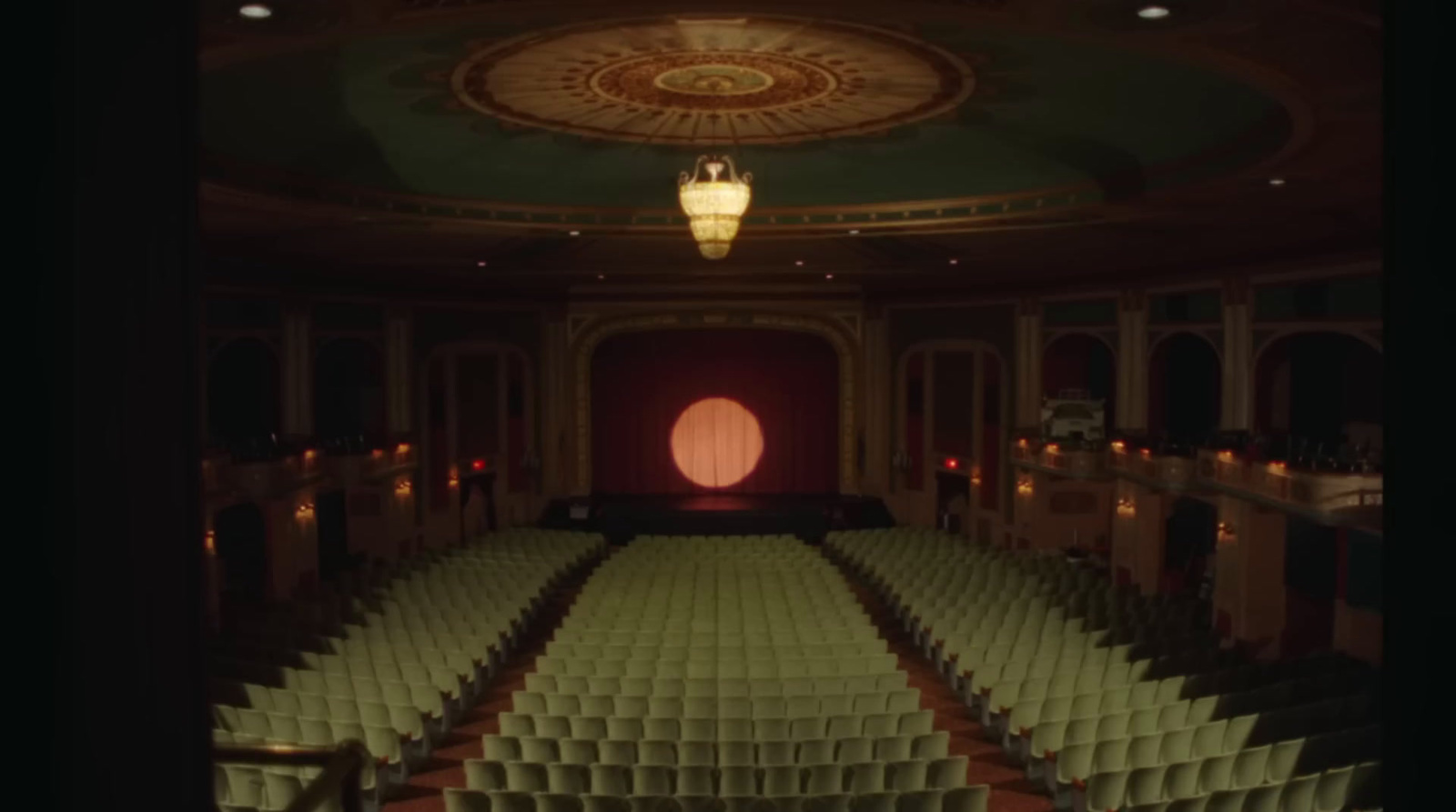 a large auditorium with rows of empty seats