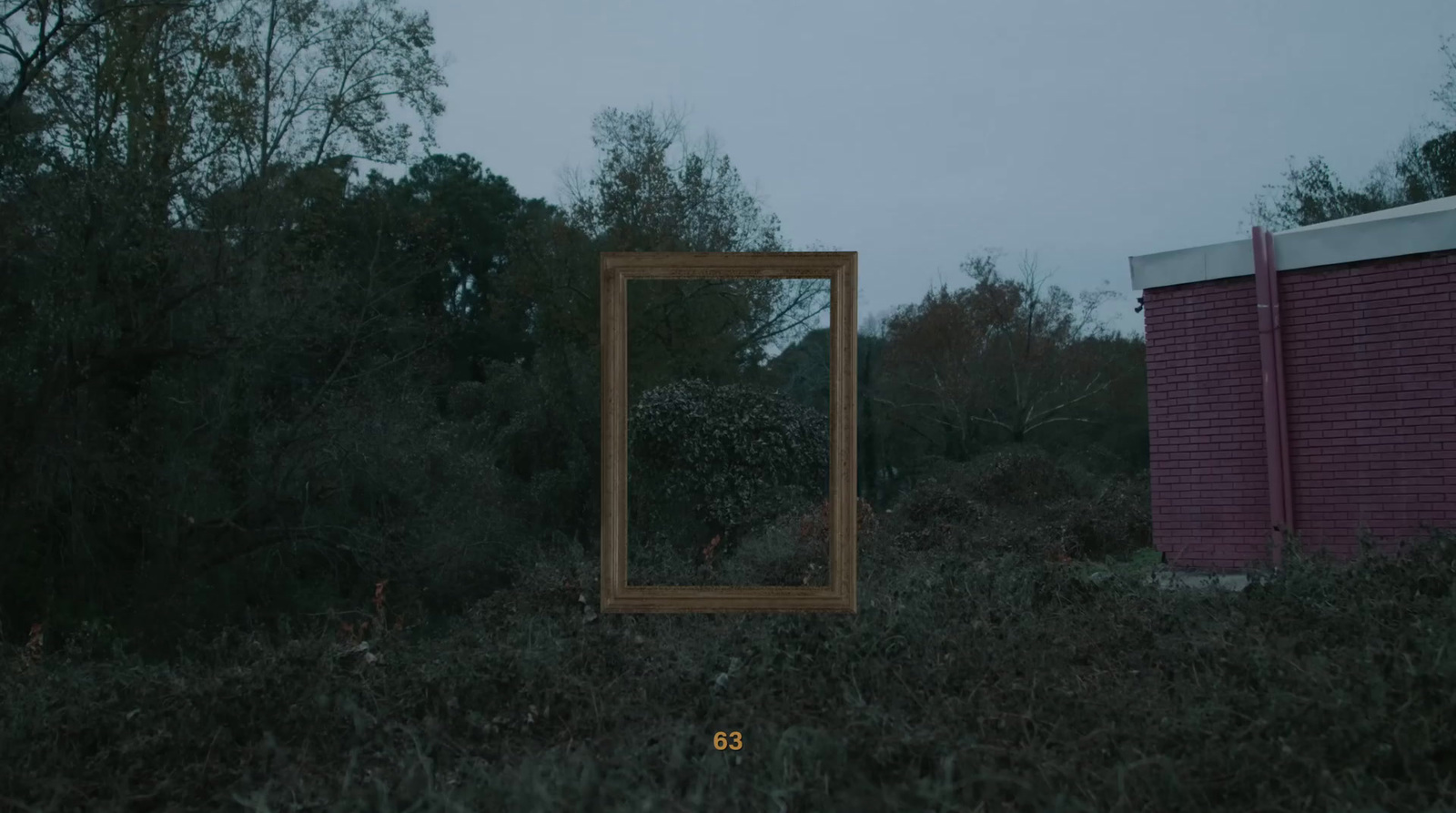 a mirror sitting in the middle of a field