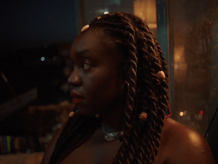 a close up of a person with dreadlocks