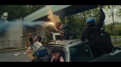 a group of people riding in the back of a truck