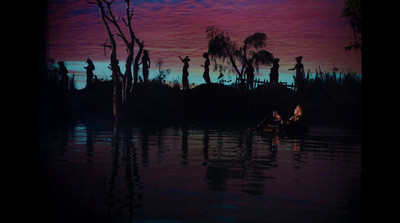 a couple of people in a small boat in the water