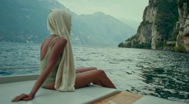 a woman sitting on a boat in the water