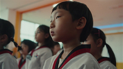 a group of young children standing next to each other