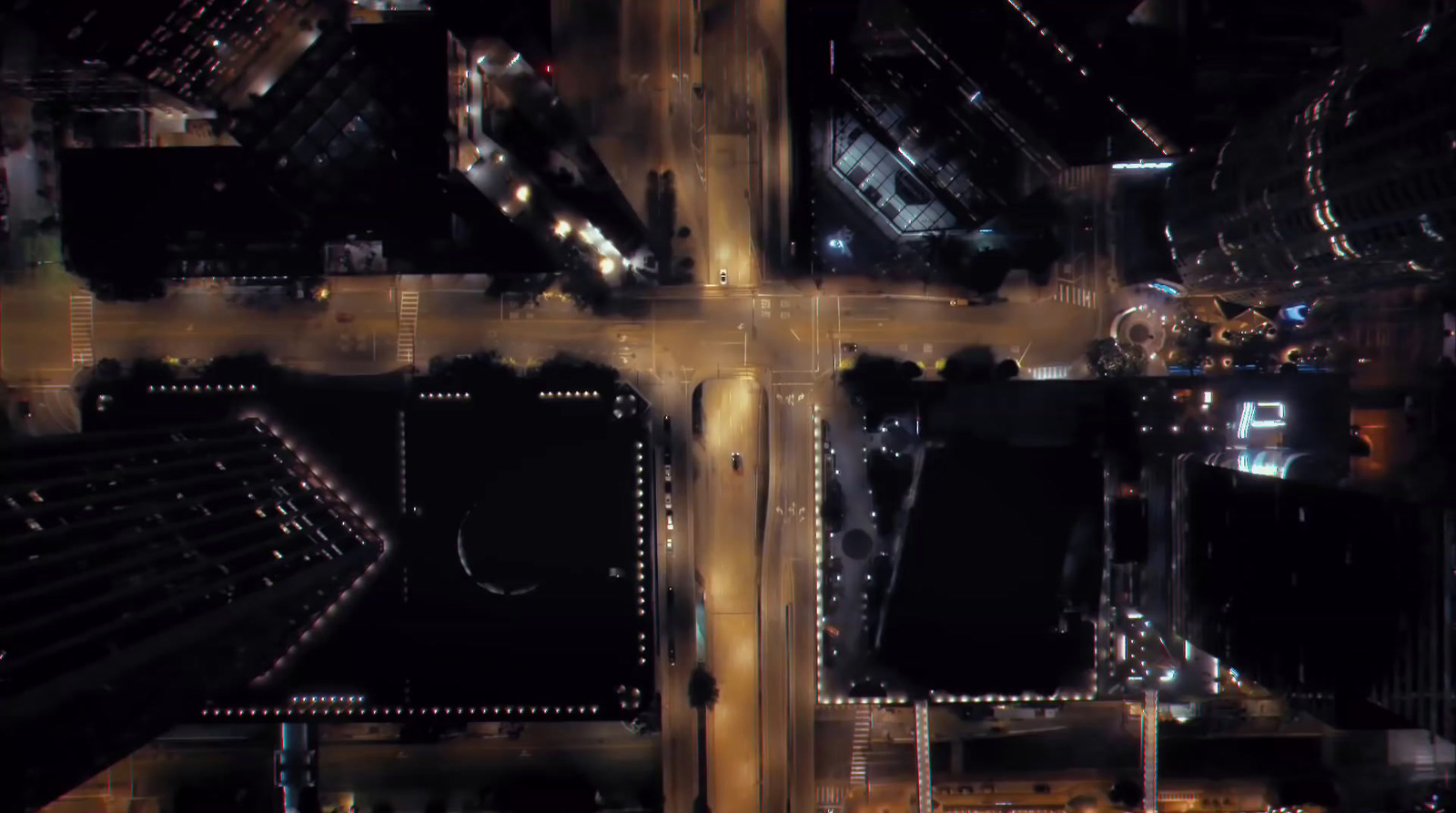 an aerial view of a city intersection at night