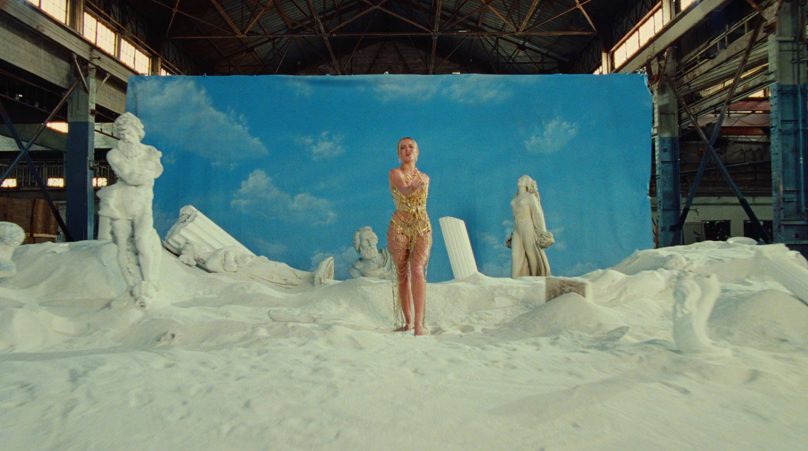 a woman in a bathing suit standing in the snow