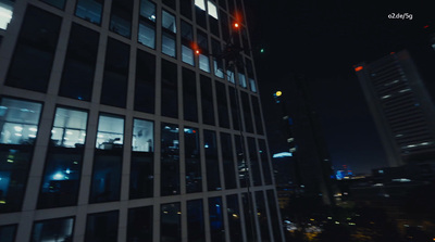 a tall building with lots of windows at night