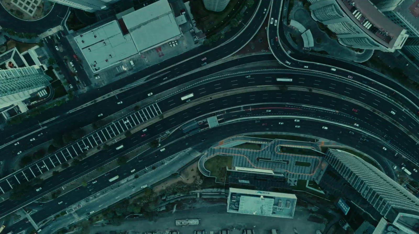 an aerial view of a highway intersection in a city