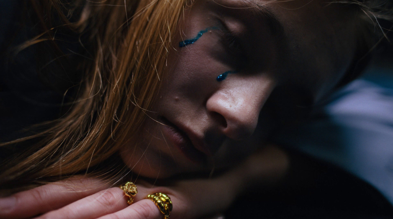 a close up of a person holding a ring